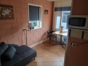 TV a/nebo společenská místnost v ubytování vakantiehuis en appartement De Harscamp