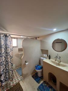 a bathroom with a sink and a toilet at Canyon Dades Guest House in Akedim Msemrir +48 photos