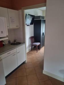 Kuchyň nebo kuchyňský kout v ubytování vakantiehuis en appartement De Harscamp