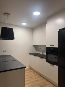 Kuhinja oz. manjša kuhinja v nastanitvi Minimalistic, Flat, Kópavogur