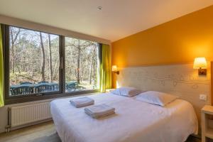 Ένα ή περισσότερα κρεβάτια σε δωμάτιο στο Cottage-8p-Les Hauts de Bruyères-225