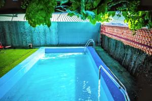 a pool of water in a backyard with a fence at Charming Villa in Vitigudino with Private Pool in Vitigudino +24 photos