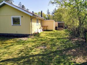 a house with a yard in front of it at Holiday Home in Thyholm
