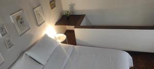 Letto o letti in una camera di La Casetta degli Innamorati
