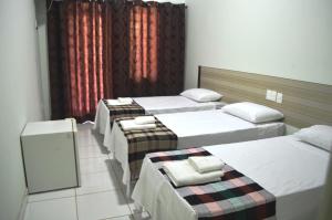 Canoas Hotel客房内的一张或多张床位