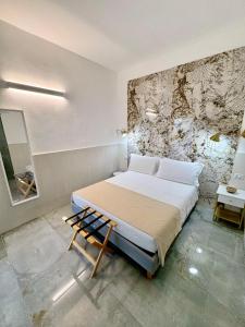 Una cama o camas en una habitación de San Pietro Home