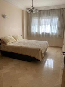 Postel nebo postele na pokoji v ubytování Quiet and spacious modern apartment near TGV station