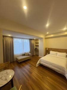 Tempat tidur dalam kamar di Hotel snowlion