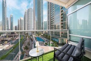 a balcony with a view of a city at Beautiful 2 BR Apartment next to Opera I Burj View in Dubai