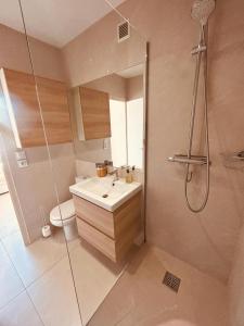a bathroom with a sink and a shower at Studio Eden vue mer in Saint-Tropez