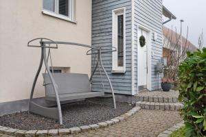 a bench sitting outside of a house at Hildas Plätzchen in Oberkirch