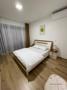 Postel nebo postele na pokoji v ubytování pazaric residence