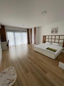 Postel nebo postele na pokoji v ubytování pazaric residence