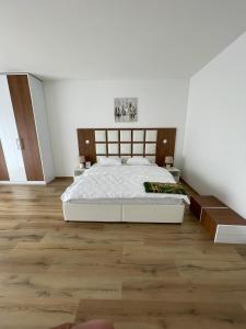 Postel nebo postele na pokoji v ubytování pazaric residence