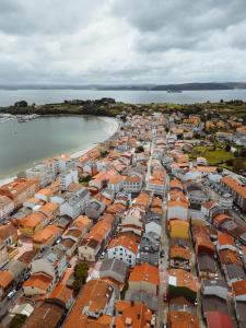 an aerial view of a city next to the water at Apartamentos Ares Rentals in Ares