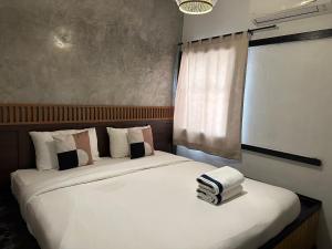 Postel nebo postele na pokoji v ubytování Costa Bed Hua Hin