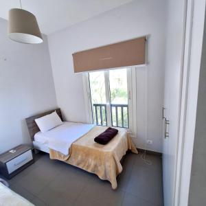 Ένα ή περισσότερα κρεβάτια σε δωμάτιο στο 2 Bedrooms First floor in Waterside Residence