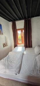 Voodi või voodid majutusasutuse Riad Nizwa toas