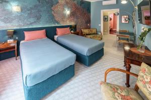 Letto o letti in una camera di Tu chiamale emozioni 3 suite