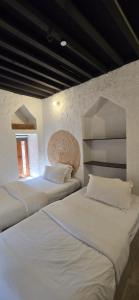 Voodi või voodid majutusasutuse Riad Nizwa toas