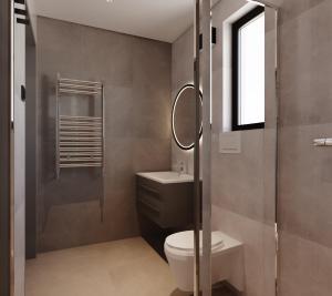 a bathroom with a toilet and a sink and a shower at Nothaugen AS in Nordheim +127 photos