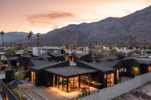 a rendering of a house with mountains in the background at Blackhaus B10 by AvantStay Modern Room Pool in Palm Springs