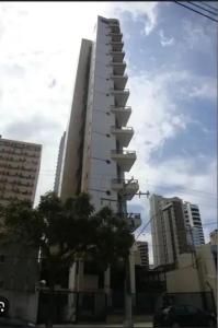 a tall building in a city with tall buildings at Multiplex Unique DOCA COP30 in Belém