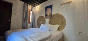 Postel nebo postele na pokoji v ubytování Riad Nizwa + 37 fotografií