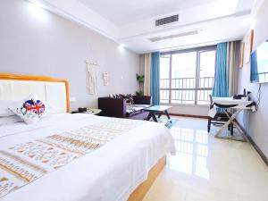 Voodi või voodid majutusasutuse Guangzhou Uhome Service Apartment toas