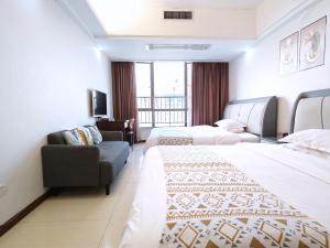 Voodi või voodid majutusasutuse Guangzhou Uhome Service Apartment toas