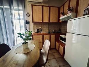 Kuchyň nebo kuchyňský kout v ubytování Cozy Apartments Mc Queen