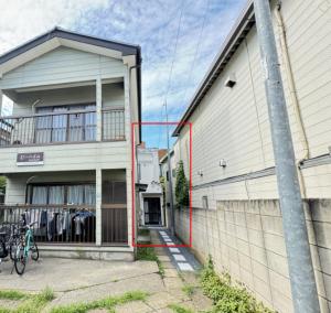 a house with a bike parked in front of it at Ikebukuro House-TS0378 in Tokyo