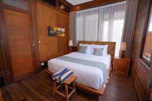 Moin Villa Lembongan客房内的一张或多张床位