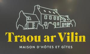a sign for a haunted house with the text travel inn at Traou ar Vilin in Pleumeur-Bodou