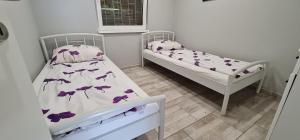 Posteľ alebo postele v izbe v ubytovaní Picurka Apartman