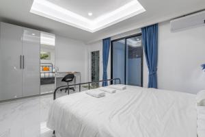 Letto o letti in una camera di 芭提雅市中心 现代轻奢 独栋双层泳池别墅 五房六卫 全新 大空间