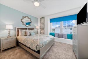 a bedroom with a bed and a window at The Ultimate Mansion on Solara Resort Orlando Mansion 5304 in Kissimmee +64 photos