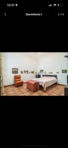 a bedroom with a bed and a table and a couch at La Manga in Setenil