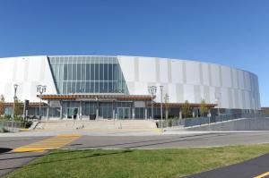 a large glass building with a road in front of it at Velohome - 3-Bed, 2-Bath Home in Milton