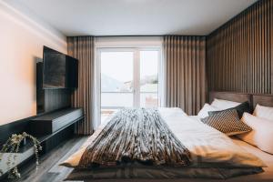 Postel nebo postele na pokoji v ubytování Lynett Suites