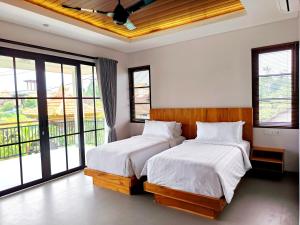 Sawitri Anandhita Luxury Villas客房内的一张或多张床位