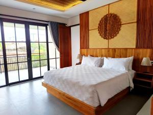 Sawitri Anandhita Luxury Villas客房内的一张或多张床位