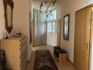 a hallway with a door and a room with a rug at Zweitbettzimmer Hannover in Hannover +2 photos