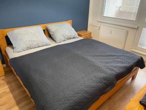 Posteľ alebo postele v izbe v ubytovaní Apartmán Letná