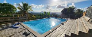 Bazén v ubytování Villa COSAROE 6-14 pers Piscine et superbe vue mer PANORAMIQUE nebo v jeho okolí