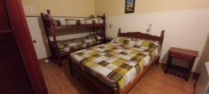 a bedroom with two bunk beds in a room at Hostel Salta por Siempre in Salta
