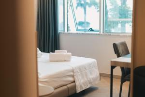 Voodi või voodid majutusasutuse Hotel Flamingo 1 toas
