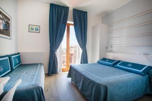 Cama ou camas em um quarto em Hotel Sardi