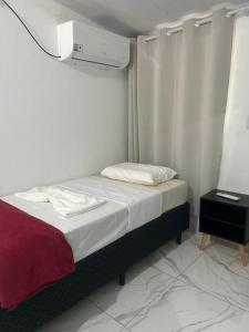 A casa roxinha客房内的一张或多张床位
