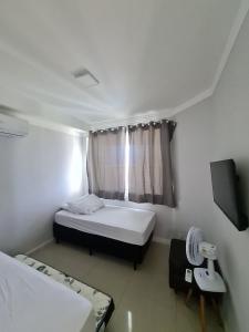 Postel nebo postele na pokoji v ubytování Sua Cobertura Tabatinga Beach Resort